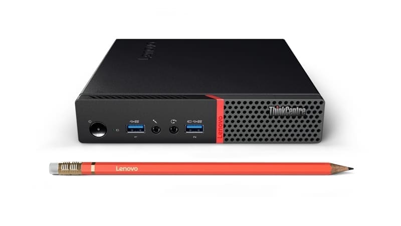 Small form factor PC beside red pencil