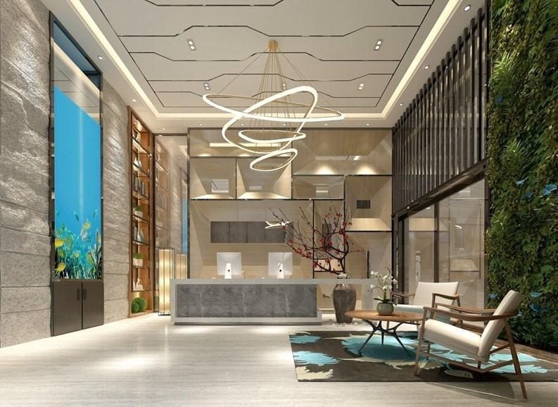 Modern lobby with artistic lighting and plants.