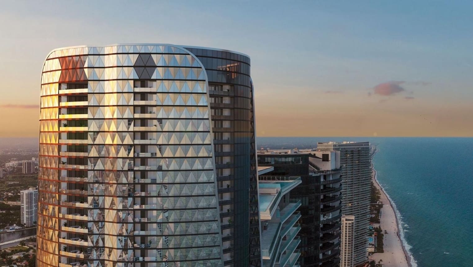 Futuristic skyscraper by the ocean at sunset.